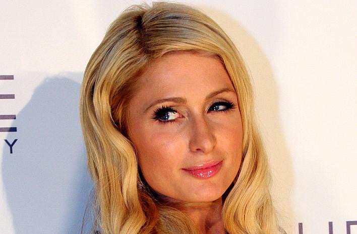 Close-up of Paris Hilton's face in front of a white background.