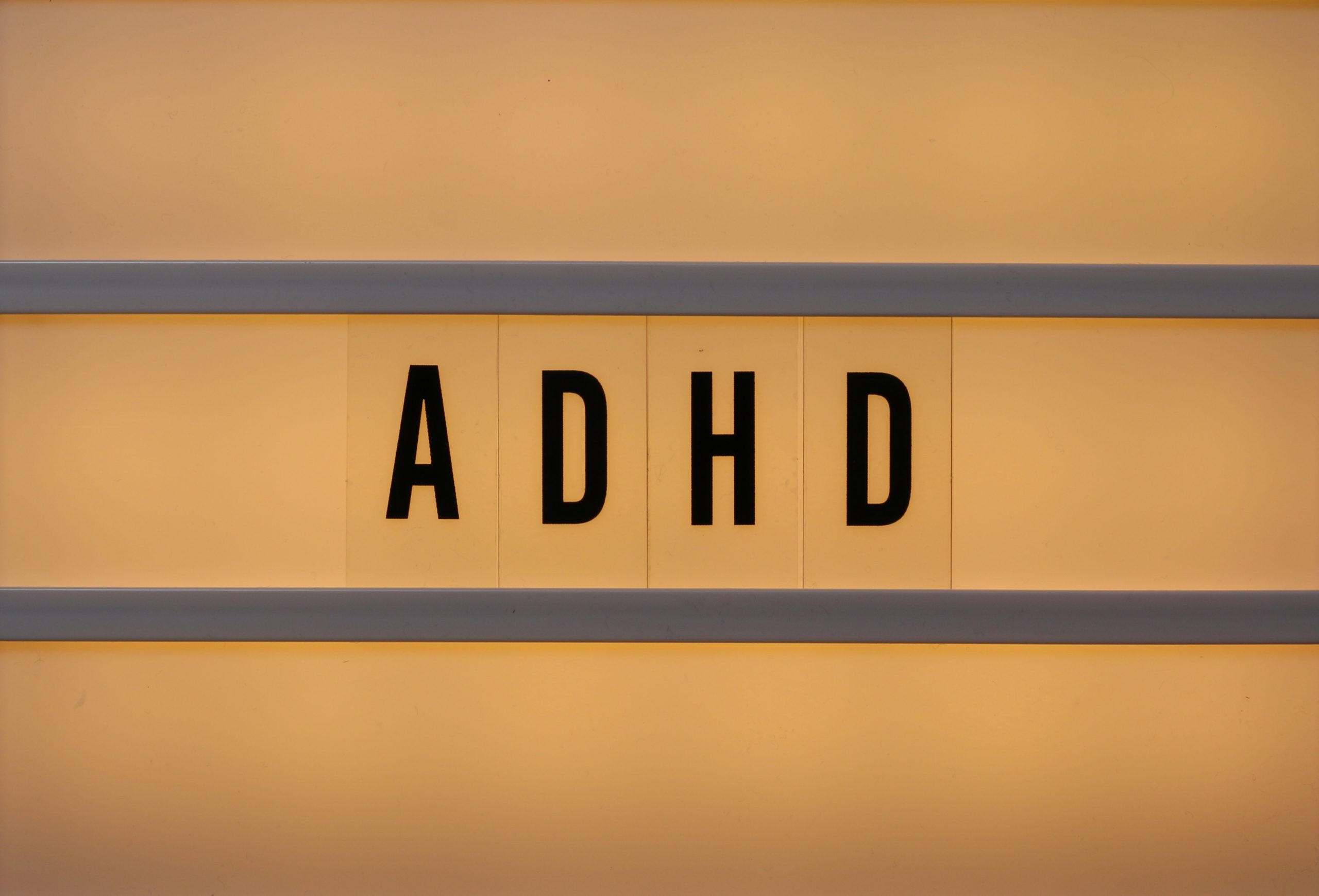 Close-up of a letter lightbox that has ADHD on it.